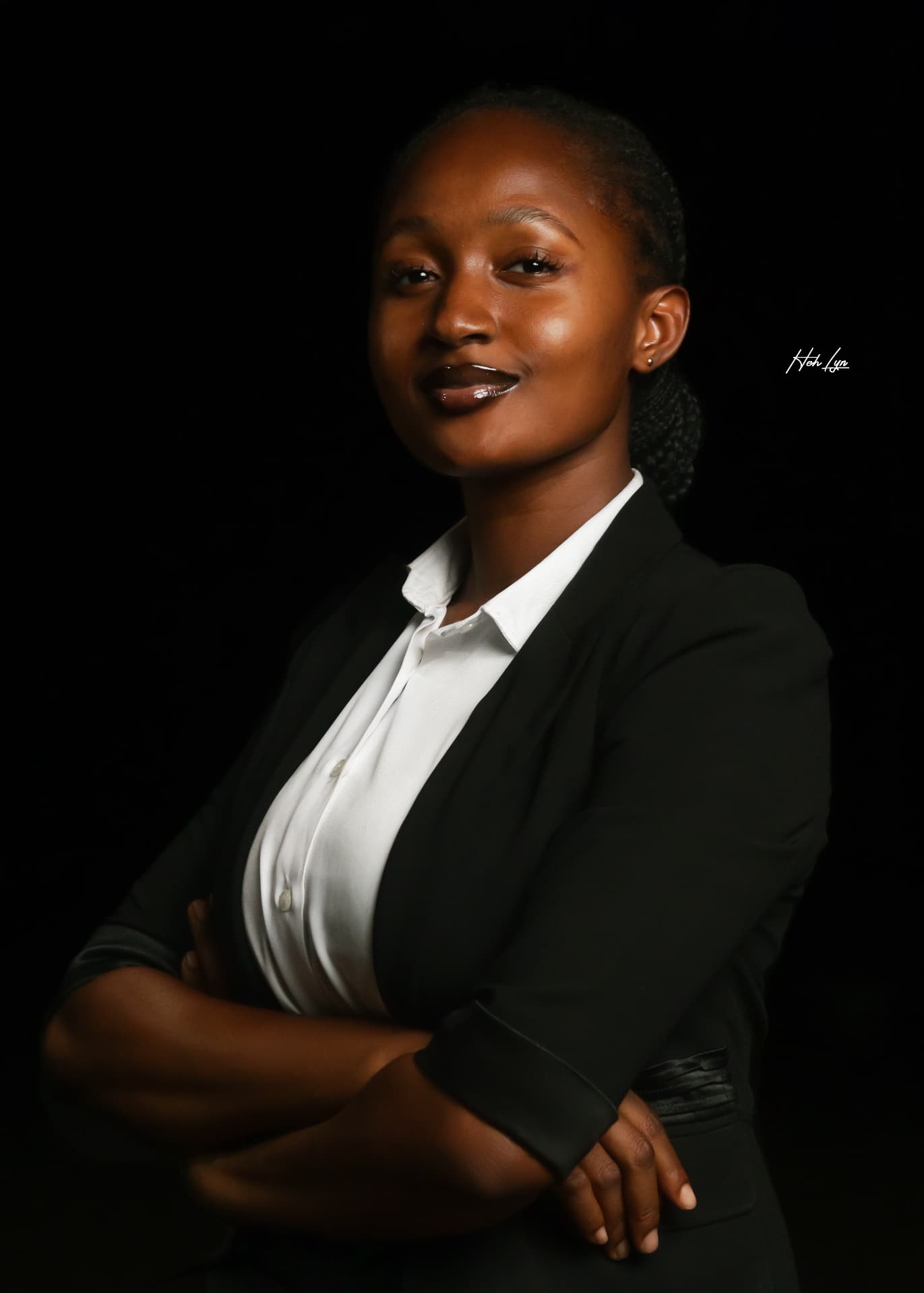 Maryjane Ejebughaobi in a black blazer, studio portrait
