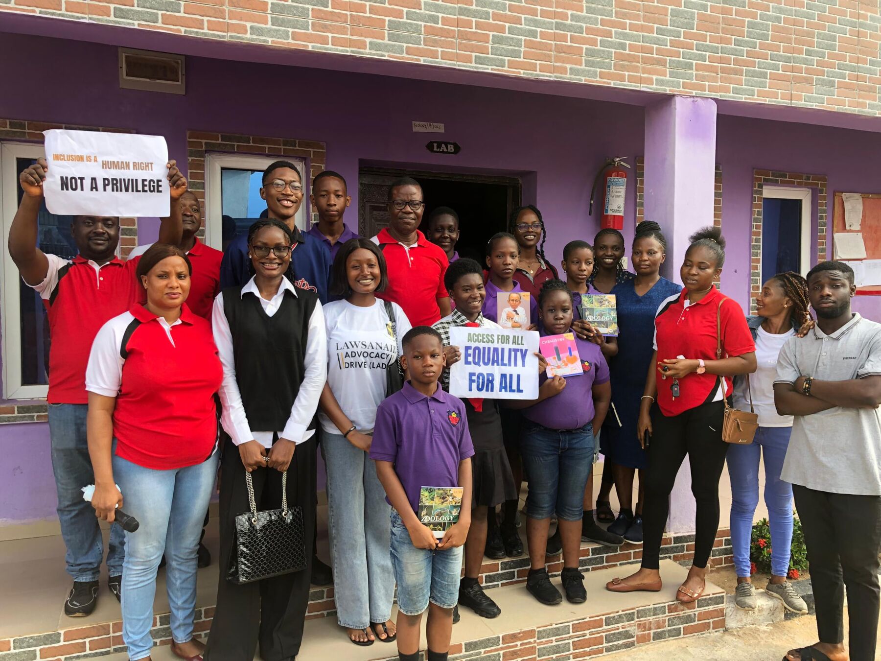Maryjane Ejebughaobi with participants at a LAWSANAID inclusion outreach